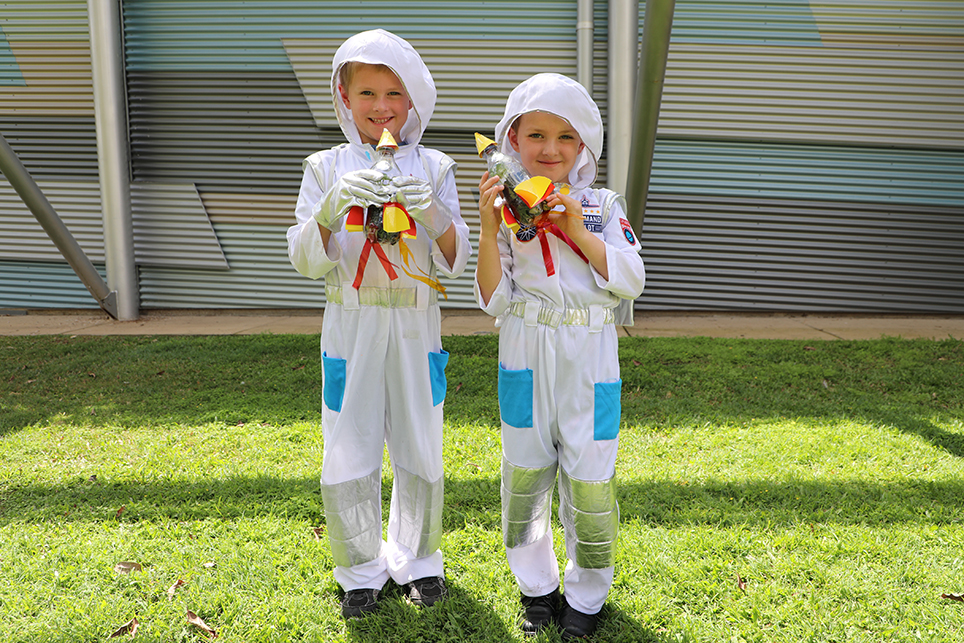 LITTLE ASTRONAUTS: Nathan and Alistair Job dressed up for the Rocket Ship Planter workshop at the Hinkler Hall of Aviation in the Botanic Gardens today.