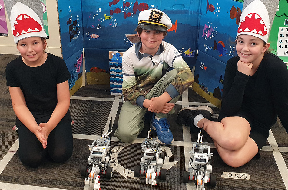 Bundaberg East State School students Chloe Rawson, Finn Heads and Charlotte Baker are heading to the RoboCup Nationals in Melbourne this week.