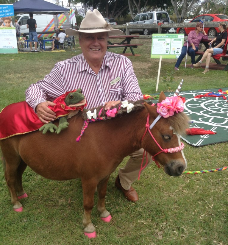 Cr Wayne Honor with George the turtle and a very cute pony at the birthday celebration.