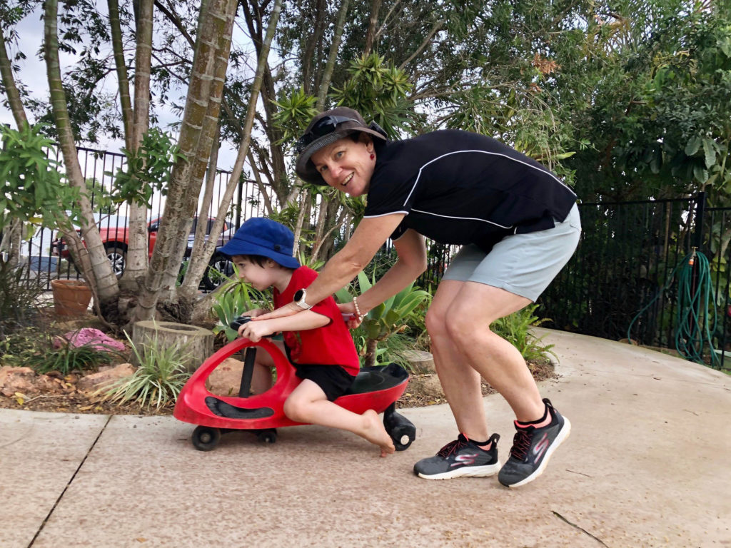 Steady as you go! Kindy director Rhonda Campbell ensures Jayden Pedemont negotiates the bicycle path safely.