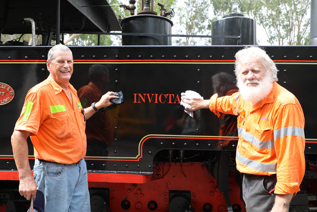 Phil Partridge and Ross Driver giving one of the locomotives a final clean before Sunday.