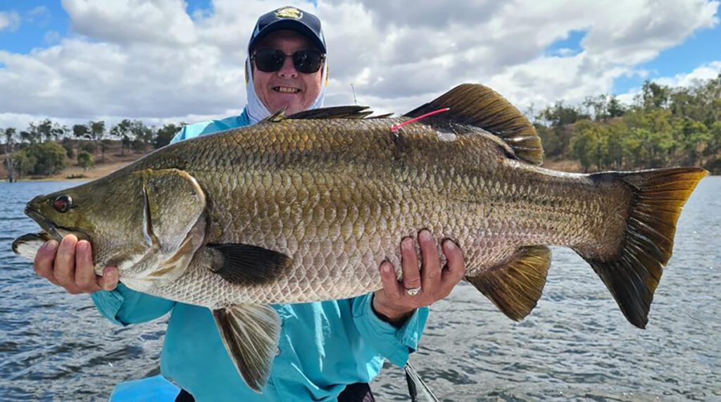 Don Patterson with a 90cm barramundi caught in Lake Monduran.