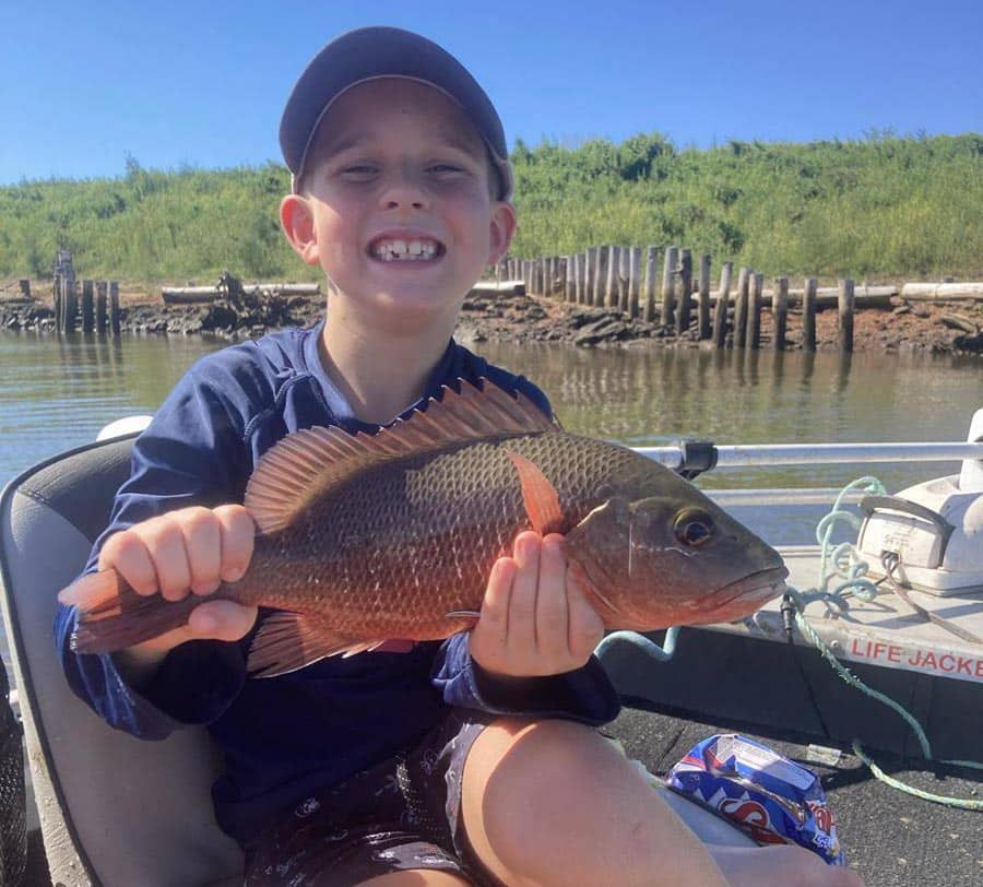 Jett Lucke with a 37cm mangrove jack caught in the Kolan.
