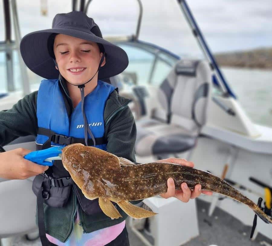 Dominic Rosenberger with his PB flathead measuring 50cm