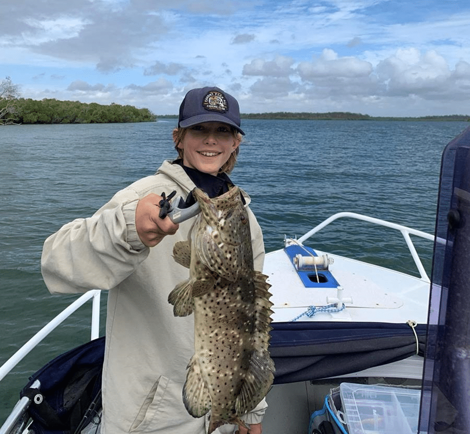 Ayden Shaw with a solid blackspot estuary cod caught in Baffle Creek