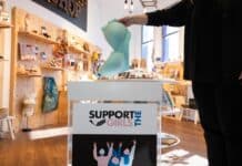 support the girls donation box at gallery