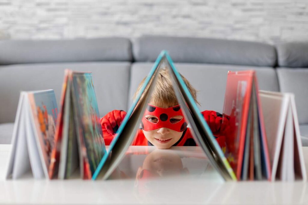 A boy dressed up with some books