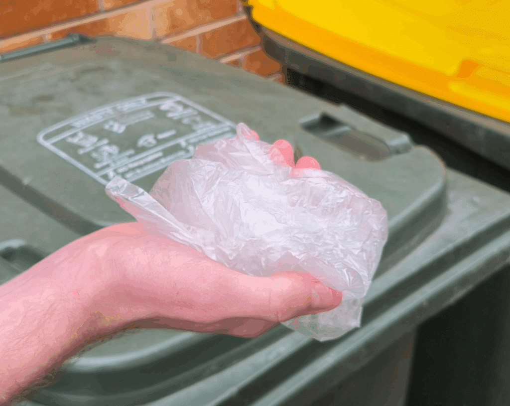 Demonstration of plastic in a hand - if you can scrunch it in your hand, it’s soft plastic and belongs in the general waste bin