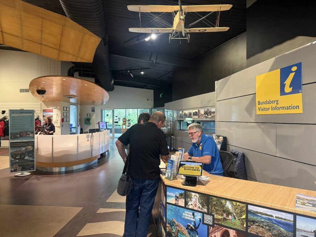 Bundaberg Tourism volunteer Gary Chandler at the Bundaberg Visitor Information desk at the Hinkler Hall of Aviation.