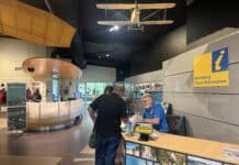 Bundaberg Tourism volunteer Gary Chandler at the Bundaberg Visitor Information desk at the Hinkler Hall of Aviation.