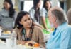 Bundaberg community backs residents Doing It Tough Volunteer having lunch with a senior man