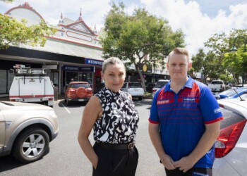 Coyne Mahoney and Daniel Unwin outside 63, 65 and 67 Bourbong Street, repainted with assistance from a Bundaberg Regional Council Our Stories Our Places grant